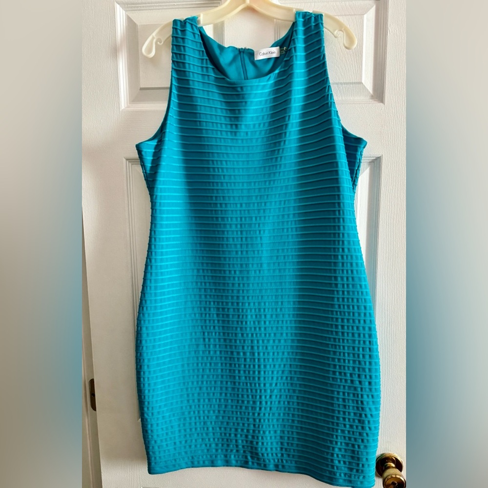 Ladies, turquoise blue Calvin Klein dress size 14 sleeveless slightly worn.